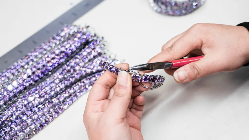 Jewelry factory employees inspect samples 2