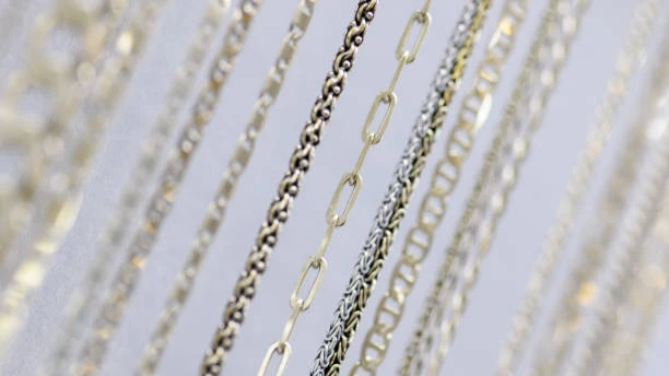 Close Up Of Hanging Silver Chain Necklaces On A Jewelry Display