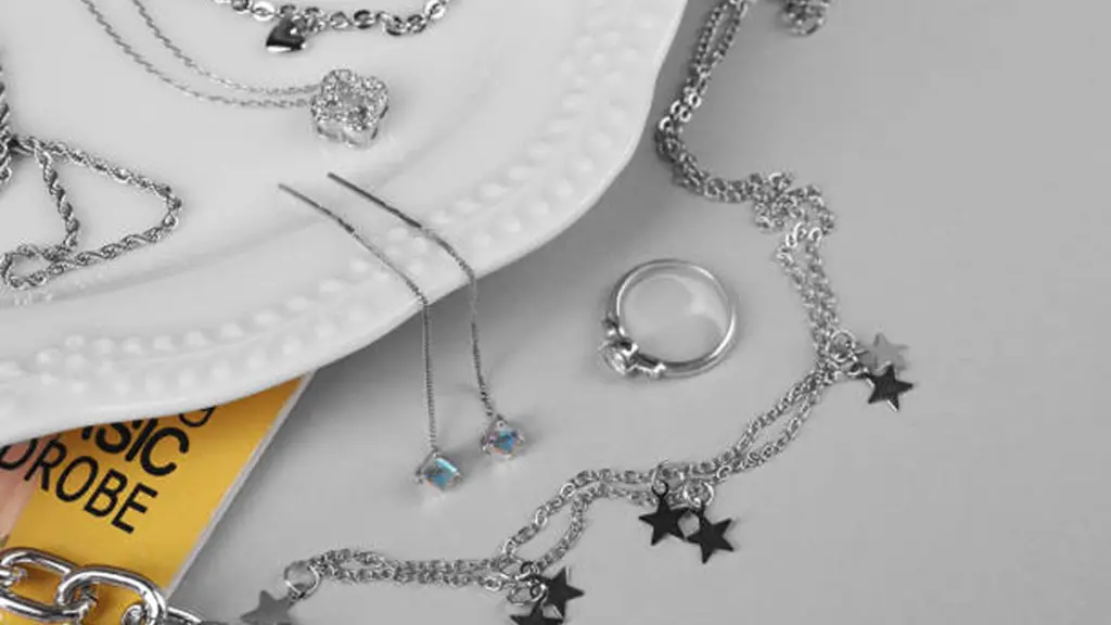 sterling silver chains and other silver accessories on light table